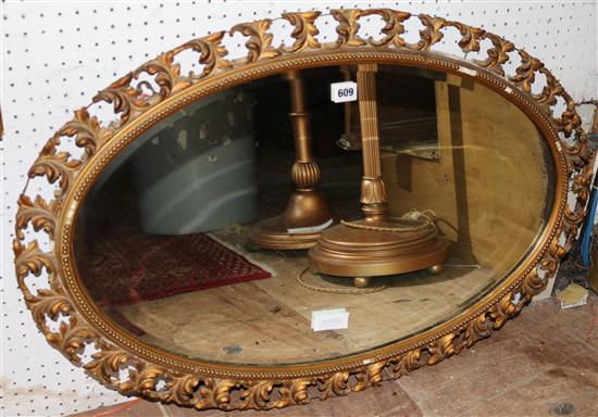 Oval gilt wall mirror